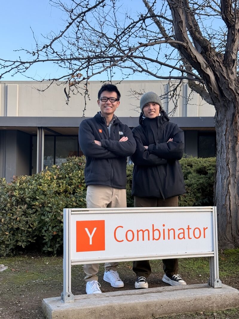 Panta's founders standing behind a Y Combinator sign